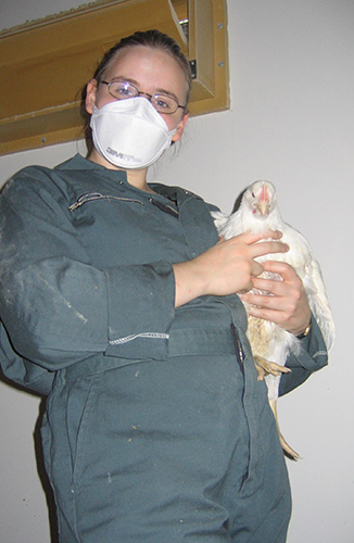 photo of louise holding a chicken