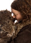 Cute picture of owner and her dog with matching curly hair and fleece